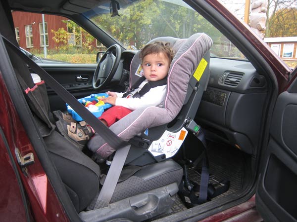 Rear facing car seat in front seat